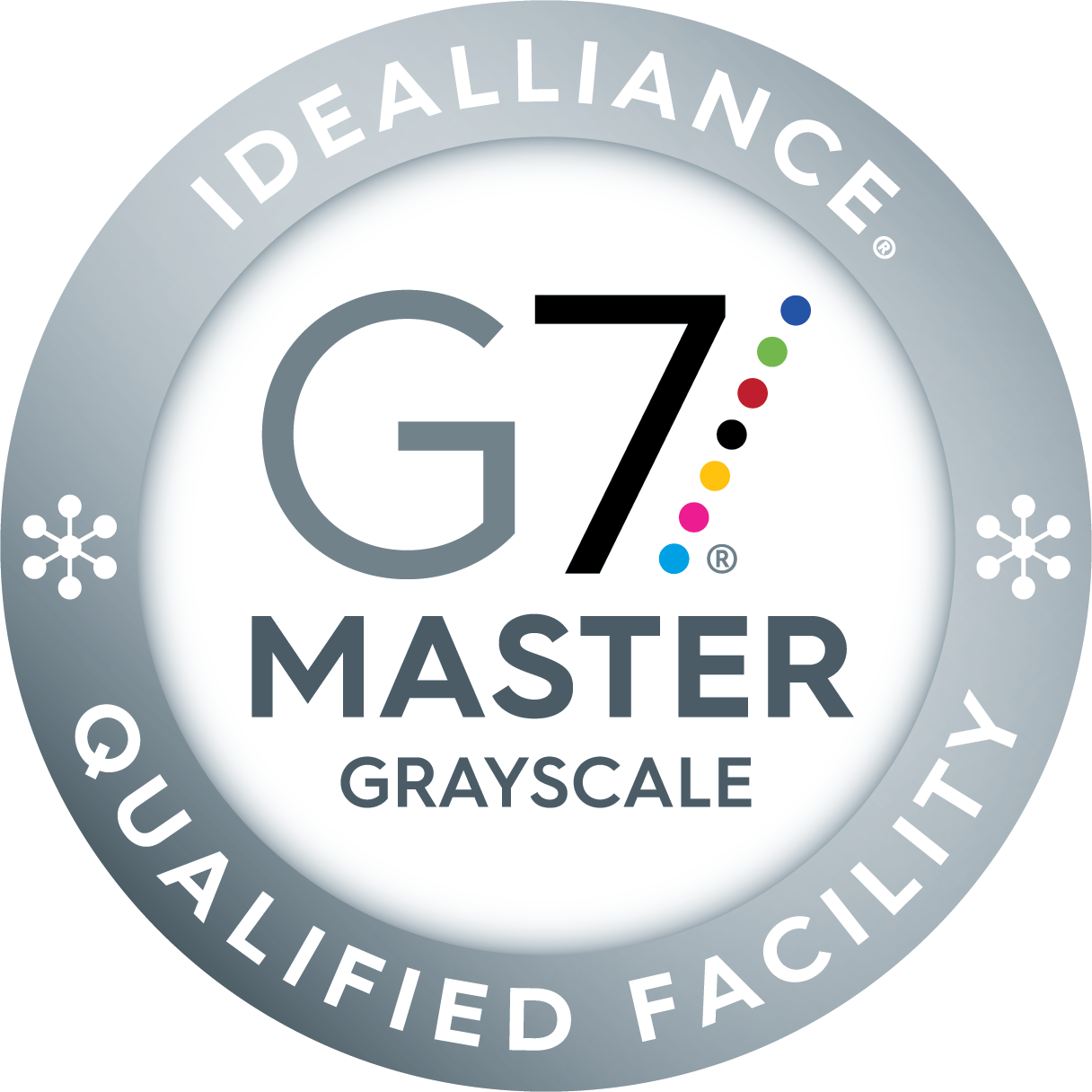 Idealliance G7 Master Grayscale Qualified Facility badge. A circular silver seal with the G7 Master Grayscale logo in the center and the text “Idealliance Qualified Facility” around the outer edge. Colored dots representing the CMYK and RGB spectrum are part of the G7 logo.